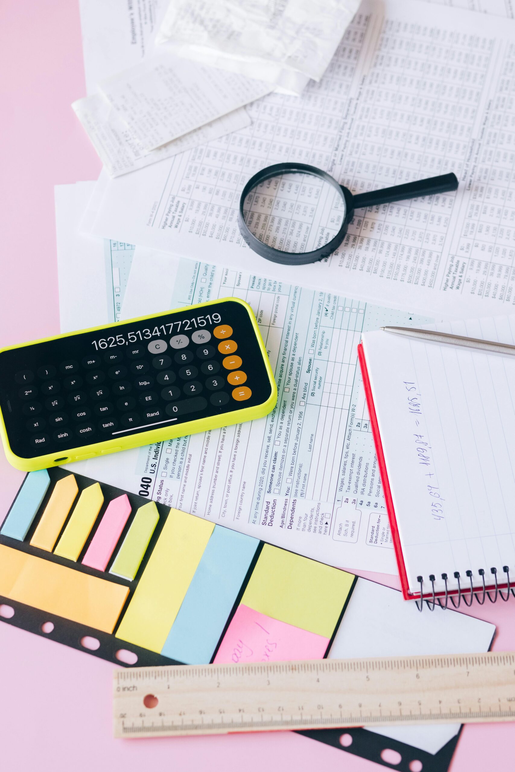 Photo by Leeloo The First: https://www.pexels.com/photo/magnifying-glass-on-white-papers-beside-a-calculator-8970289/