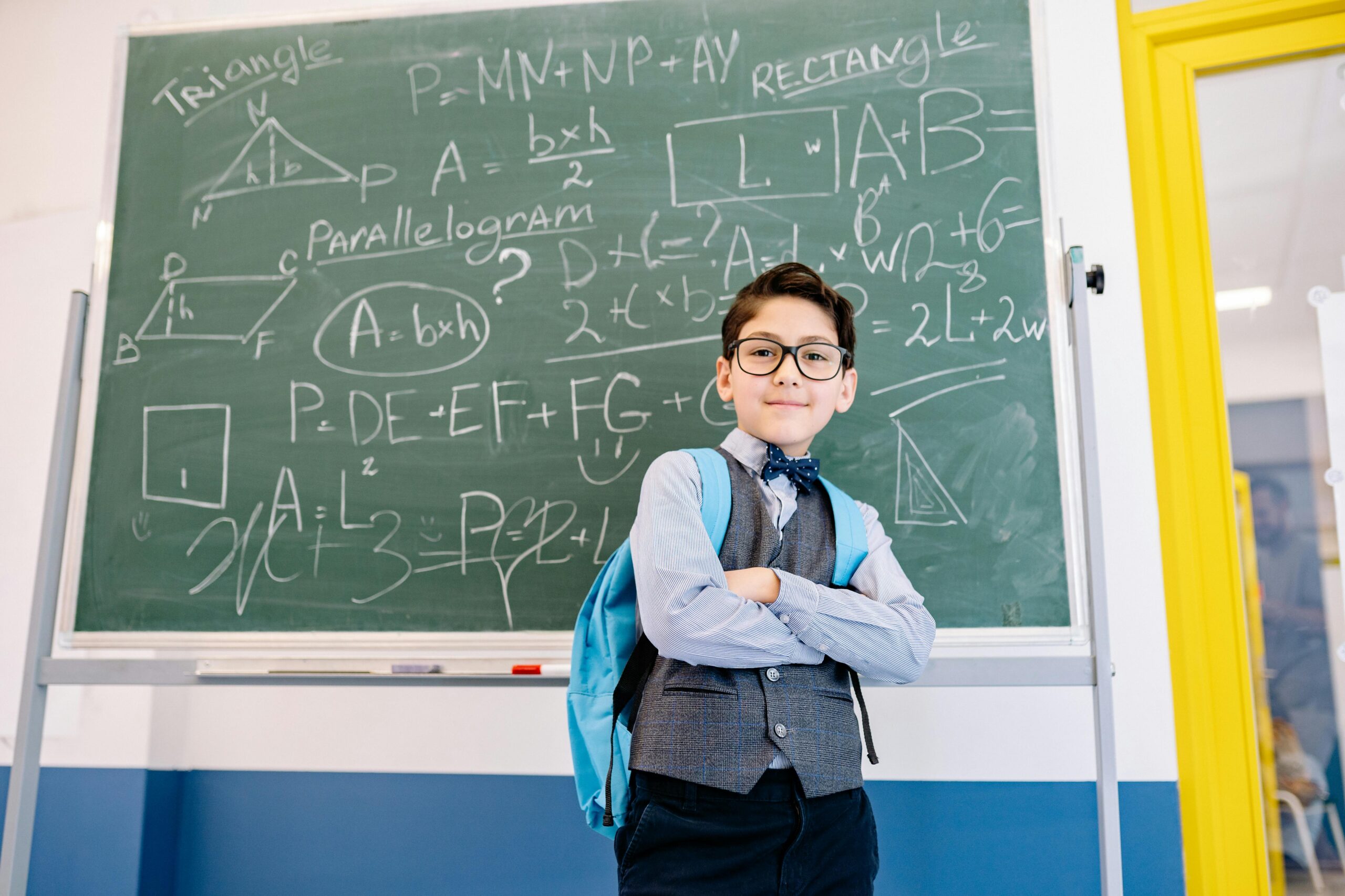 Photo by Yan Krukau: https://www.pexels.com/photo/student-standing-beside-a-chalkboard-8617644/